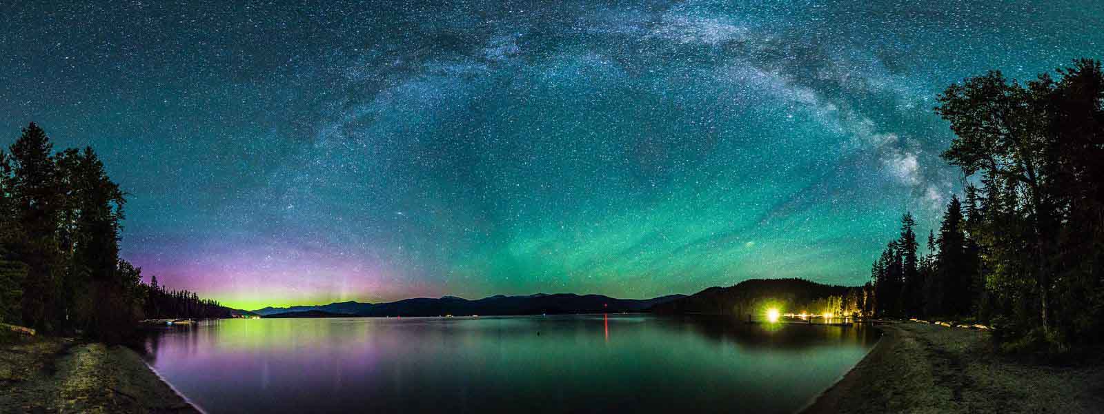 the_aurora_borealis_dances_in_the_lower_left_corner_green_waves_of_airglow_hover_to_the_rig-1